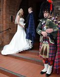Bagpiper piping at church for Brides arrival